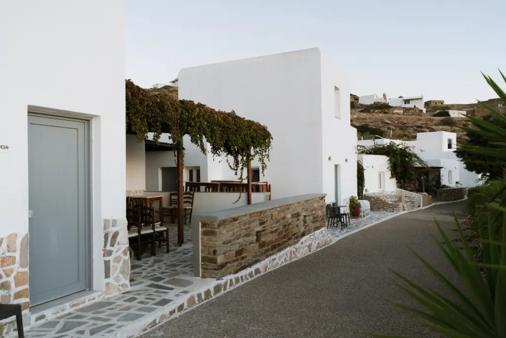 SkalaSunset private apartment exterior with stone terrace and seating area in Ios