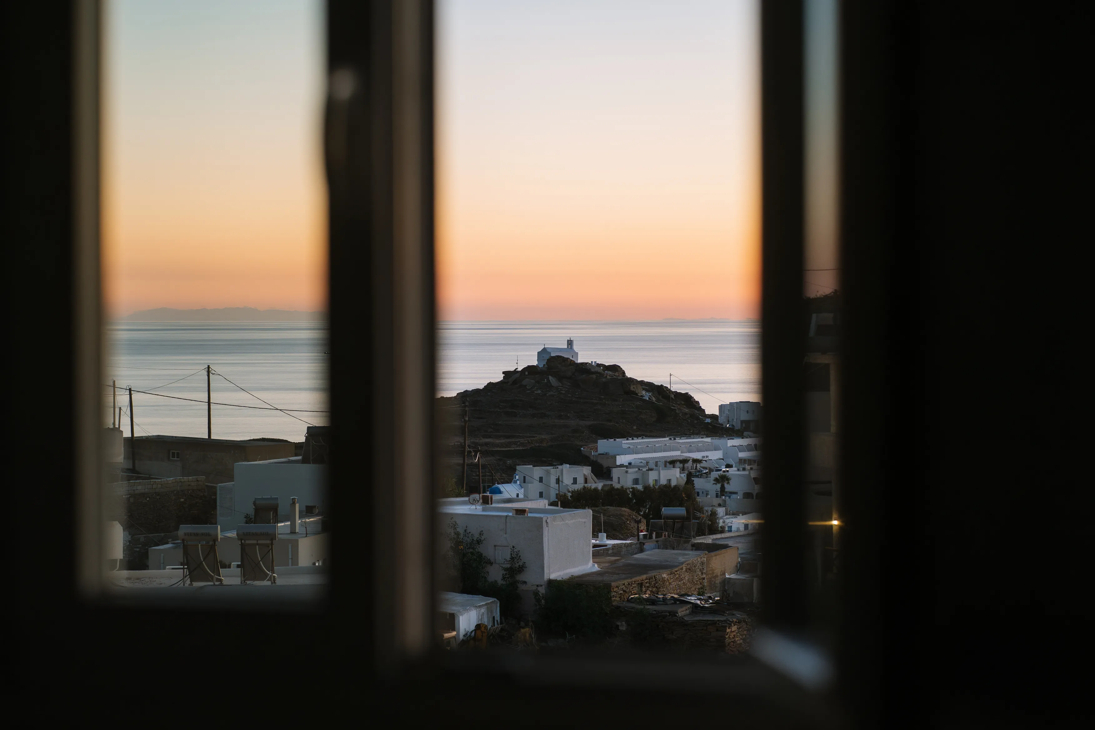 SkalaSunset deluxe double room balcony view toward Chora Ios and the sea