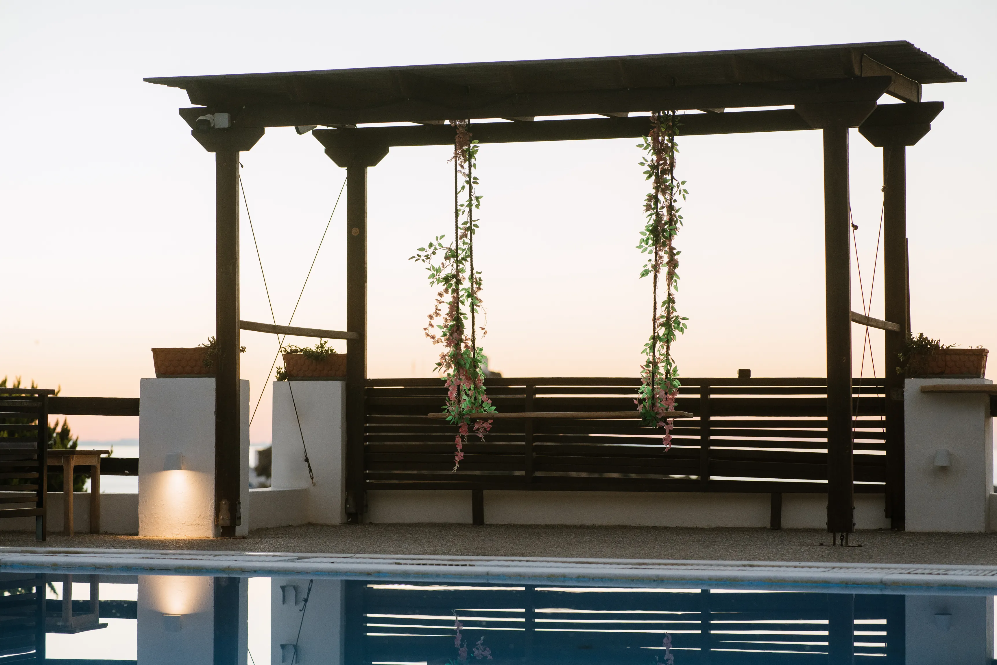 SkalaSunset triple room poolside pergola and seating by the water