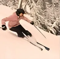 SkalaSunset skier descending snowy slope stock image