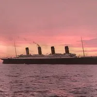 SkalaSunset cruise ship at sea during pink sunset stock image