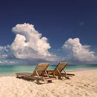 SkalaSunset beach loungers facing the sea stock image