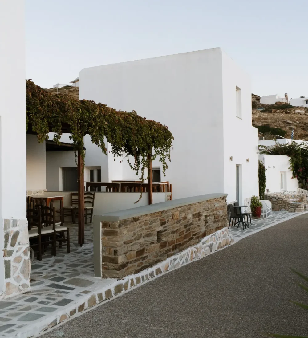 SkalaSunset private apartment exterior with stone terrace and seating area in Ios