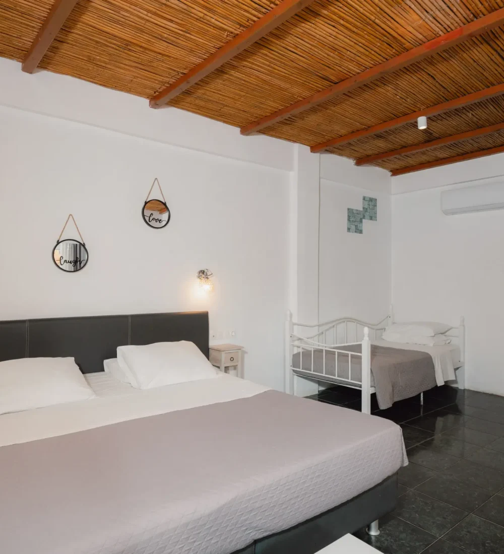 SkalaSunset deluxe double bedroom with double bed and wooden ceiling